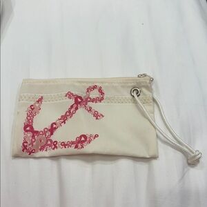 Elegant Cream Wristlet with Pink Ribbon Accent